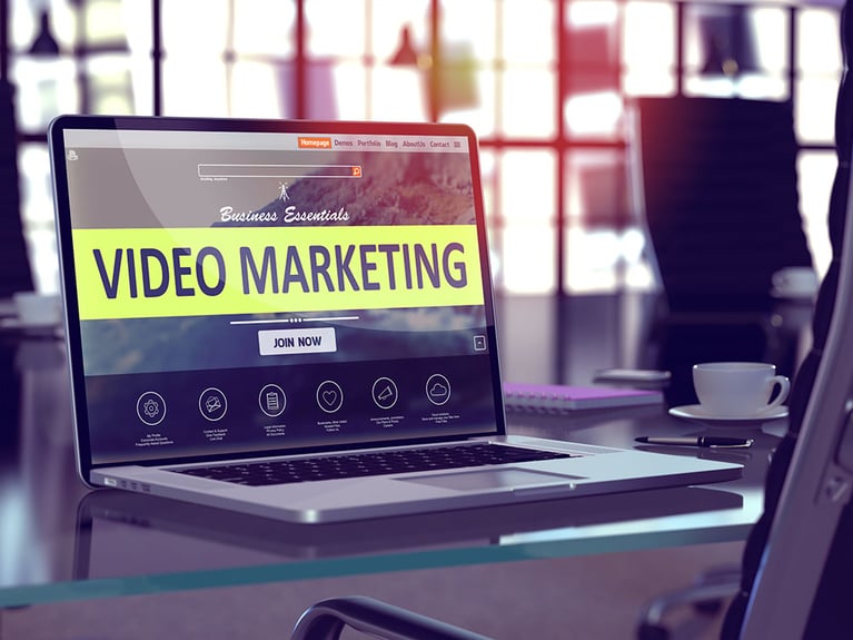 laptop with video marketing screen